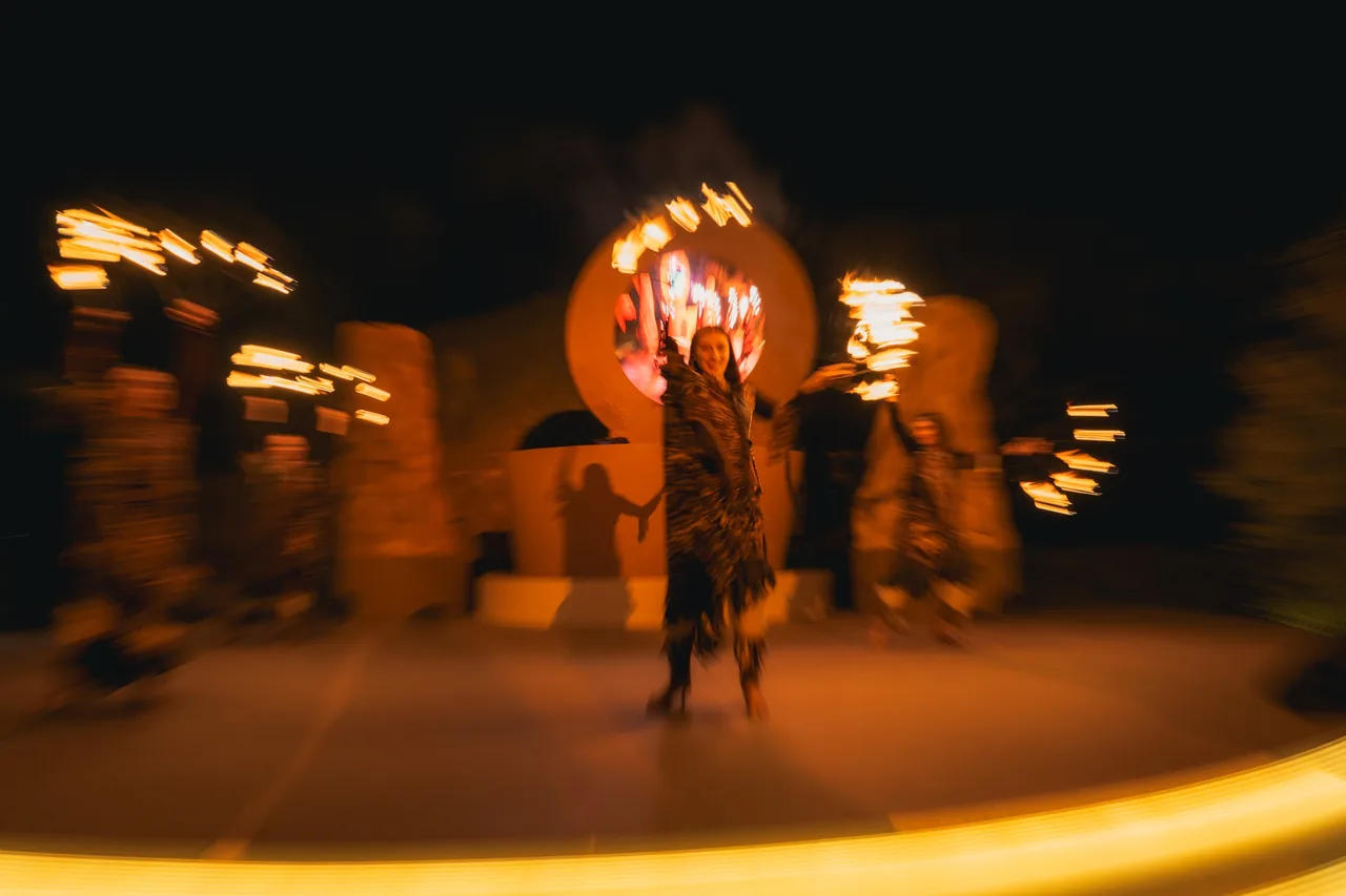Fire dancers in the desert at night